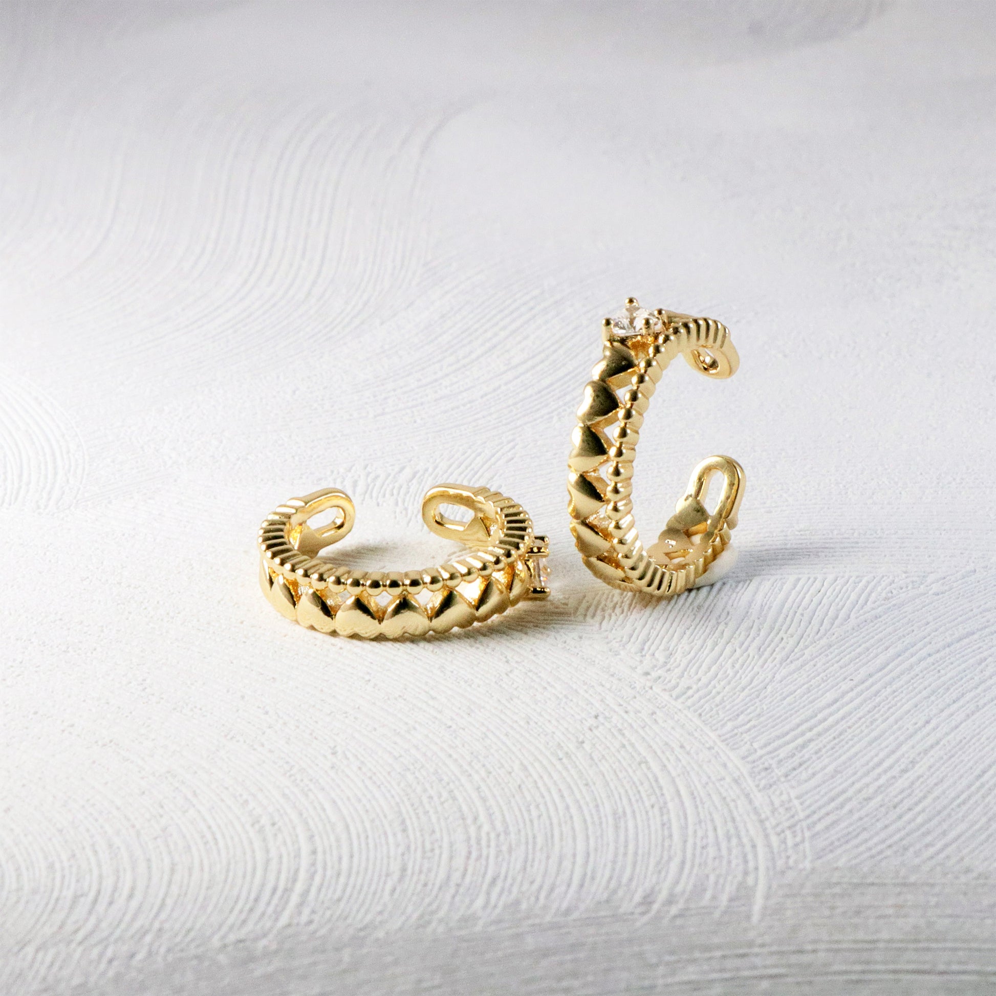 Minimalist 14K solid gold ear cuff earring modeled on a curved ear