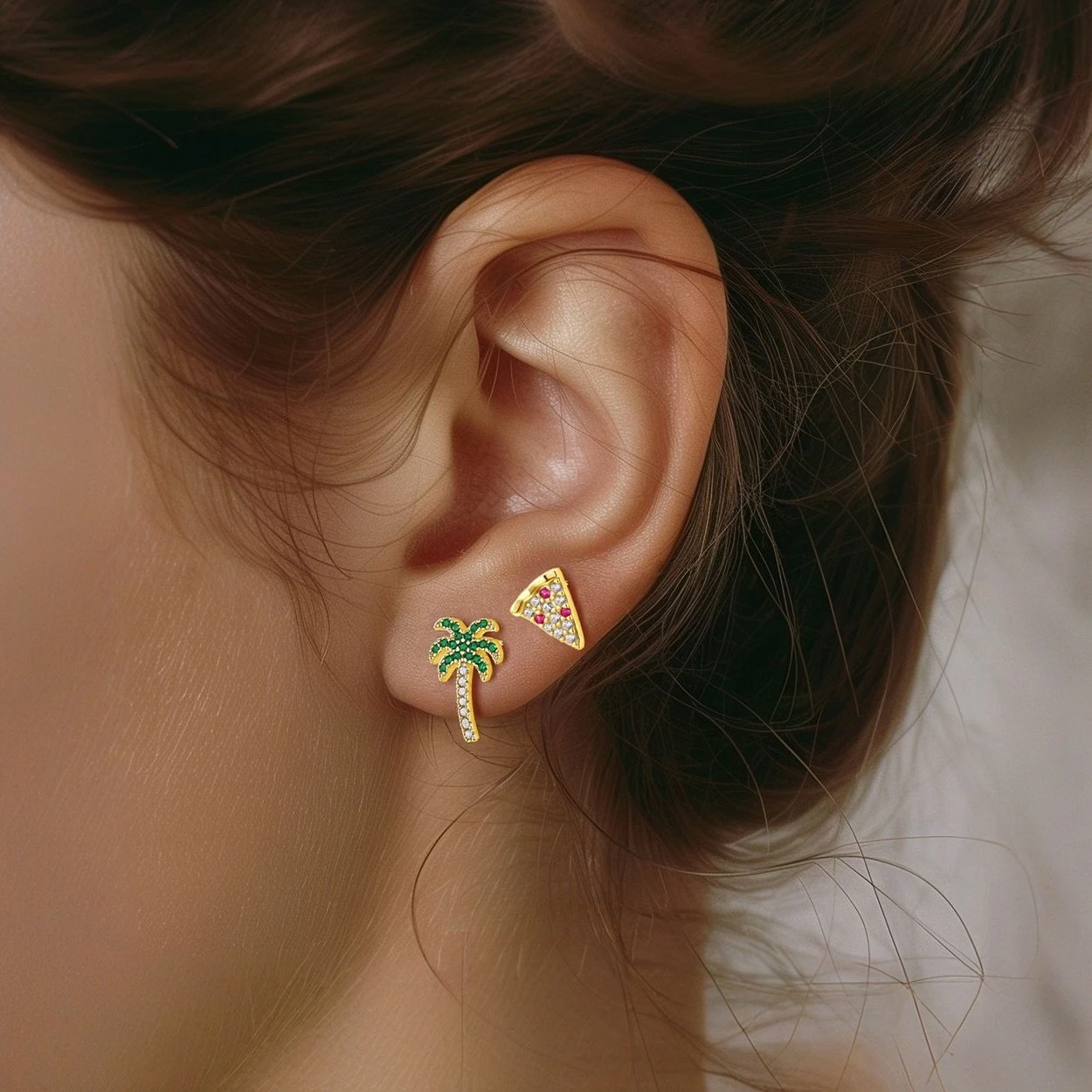 Luxury 18K gold plated mini stud earrings with colorful enamel coconut tree and pizza slice charms, displayed on seashells.