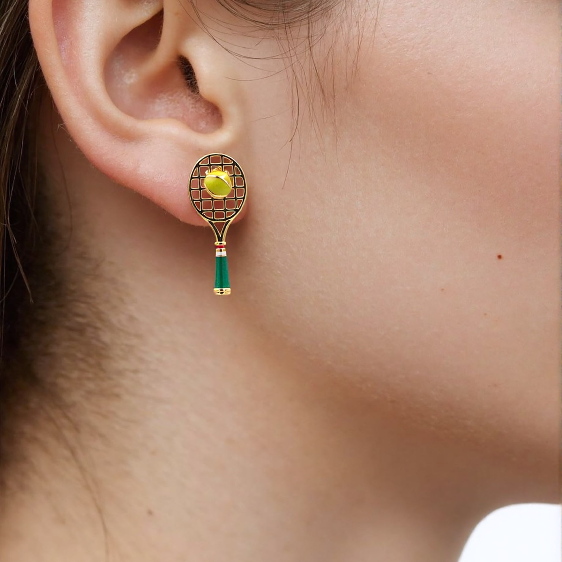 Trendy tennis-inspired mismatched earrings