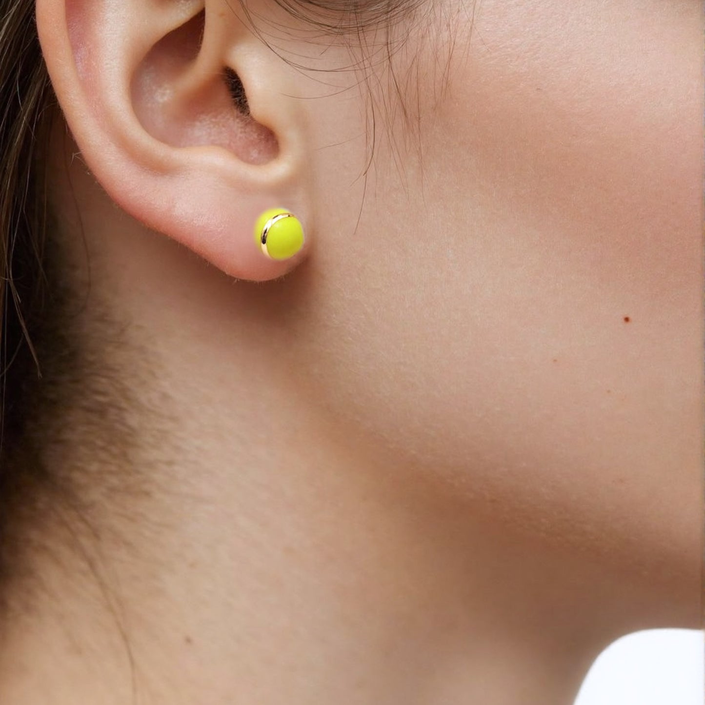 Trendy tennis-inspired mismatched earrings