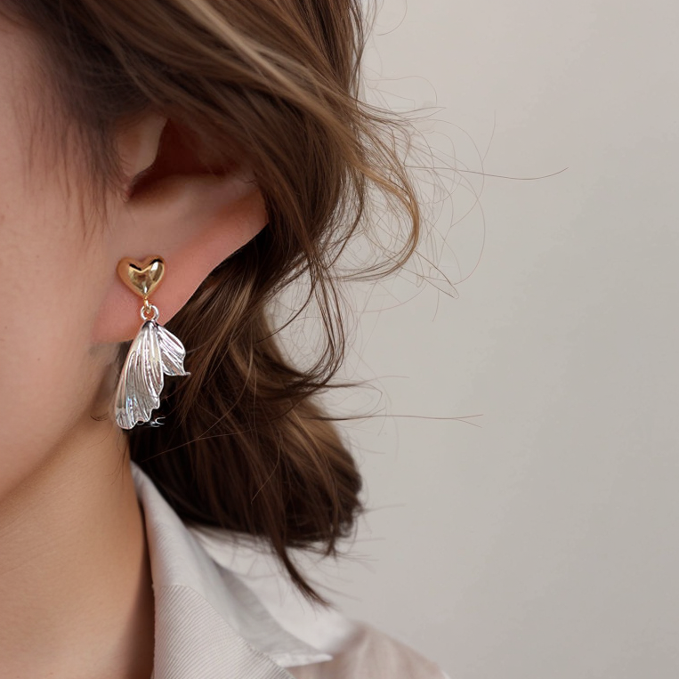 Heart earrings with wing accents