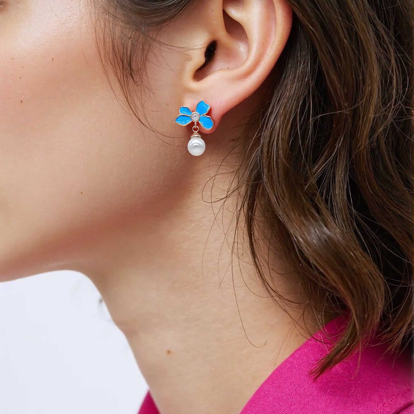 Gold plated asymmetric earrings with one floral cluster and one silk tassel