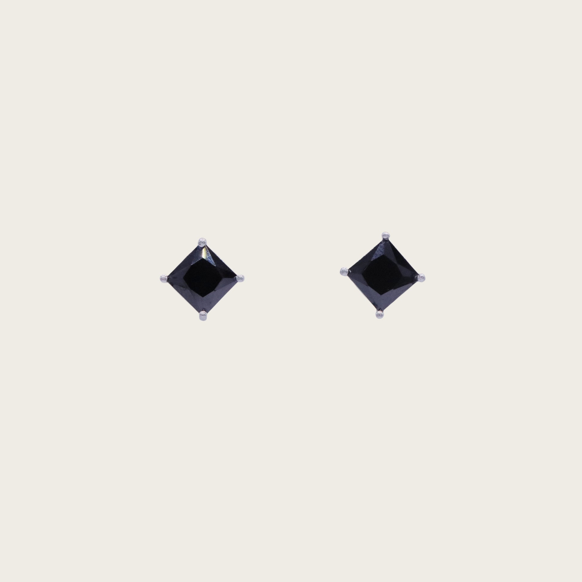 Square-cut black onyx stud earrings in a 14K gold setting