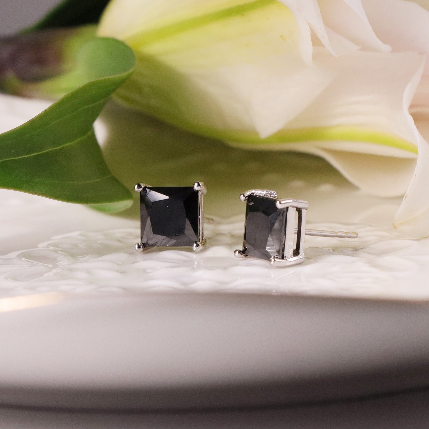 Square-cut black onyx stud earrings in a 14K gold setting