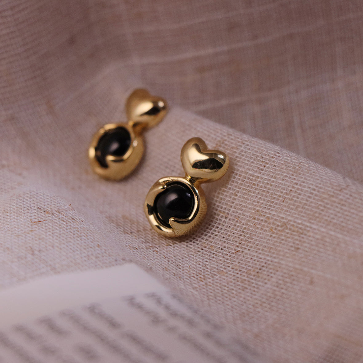 Charming heart-shaped stud earrings with natural stones