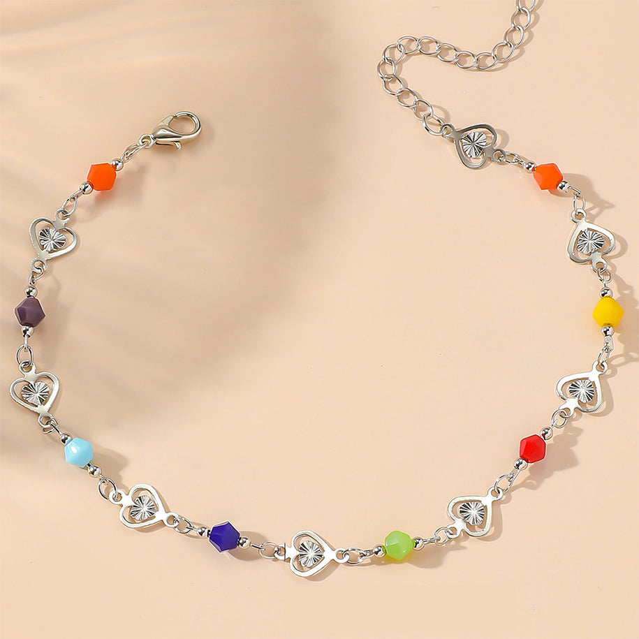 Bright candy-colored anklet with heart-shaped crystal beads on a delicate chain