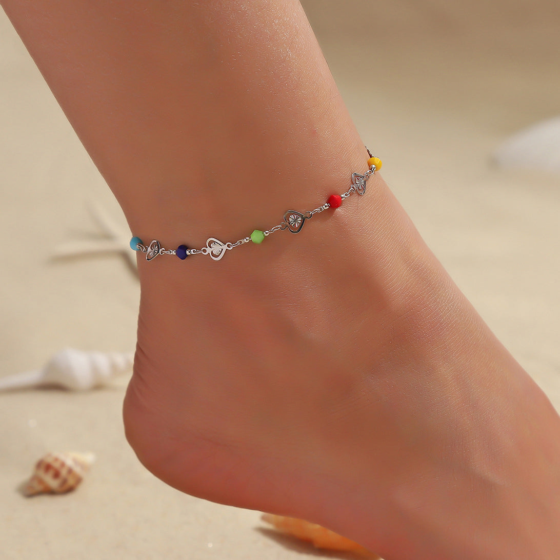 Bright candy-colored anklet with heart-shaped crystal beads on a delicate chain