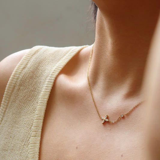 necklace featuring a delicate clover charm