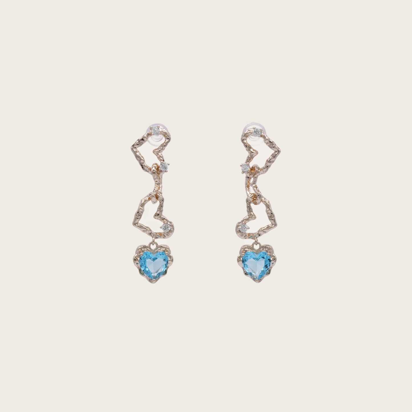 Ocean-blue crystal heart dangle earrings with 14K gold plating, featuring sparkling faceted stones in a romantic heart silhouette