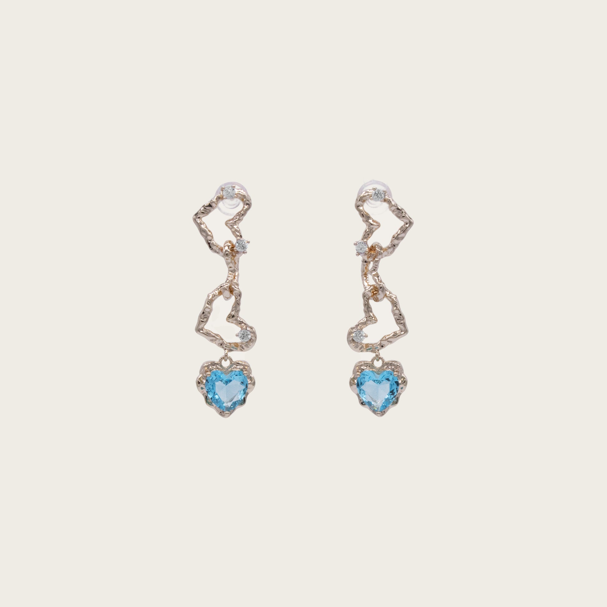 Ocean-blue crystal heart dangle earrings with 14K gold plating, featuring sparkling faceted stones in a romantic heart silhouette