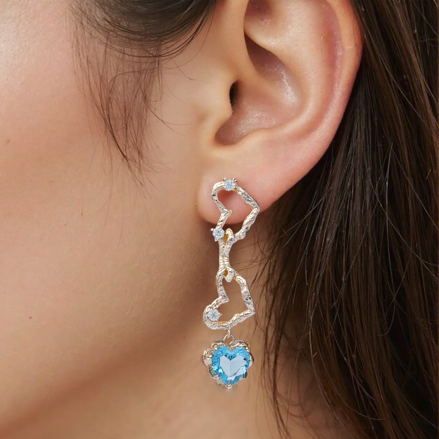 Ocean-blue crystal heart dangle earrings with 14K gold plating, featuring sparkling faceted stones in a romantic heart silhouette