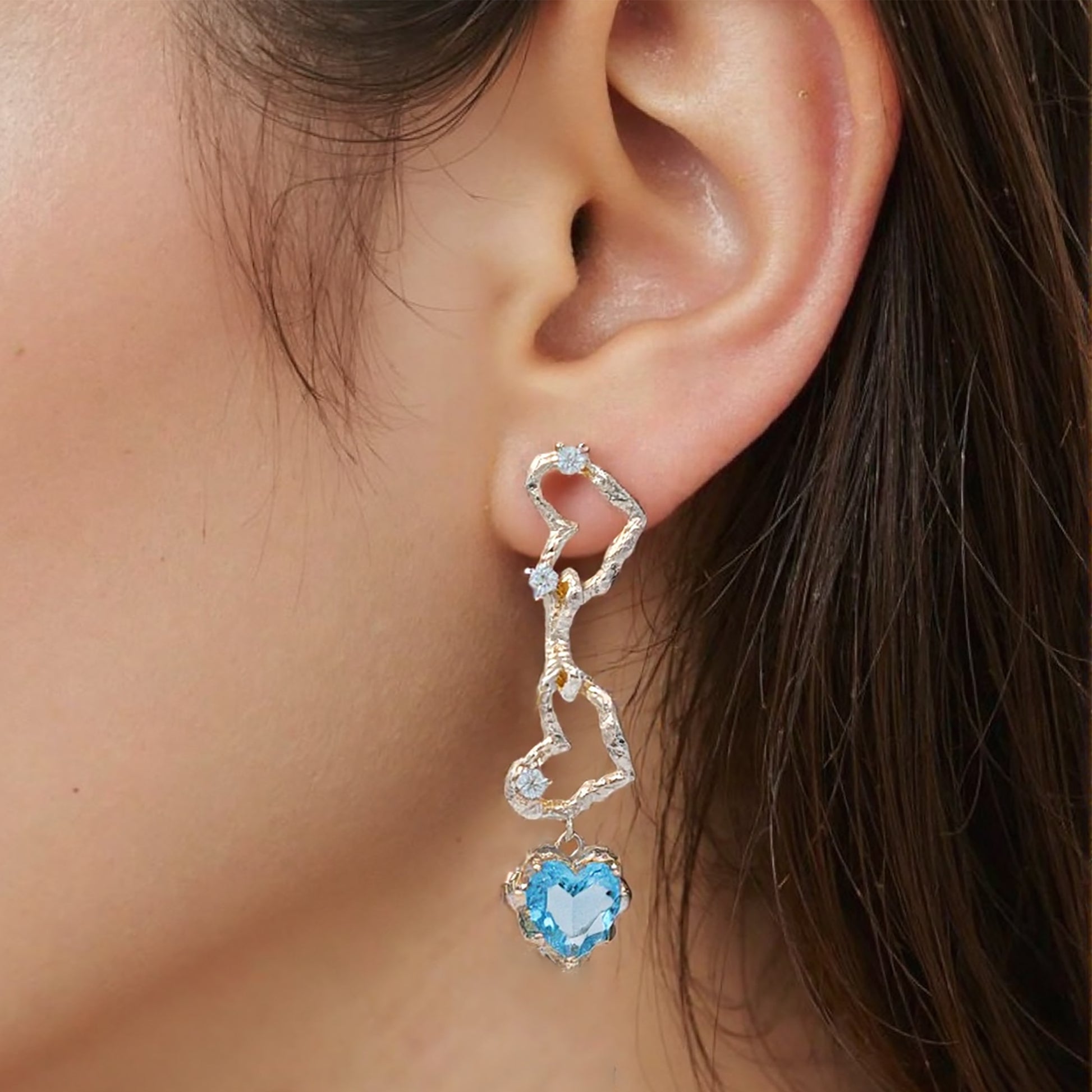 Ocean-blue crystal heart dangle earrings with 14K gold plating, featuring sparkling faceted stones in a romantic heart silhouette