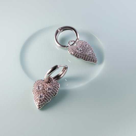 Elegant heart-shaped drop earrings with clustered zircon stones in gold/silver