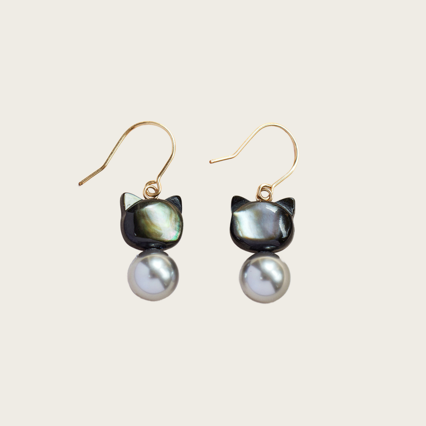 Playful kitty-shaped drop earrings with glass pearls