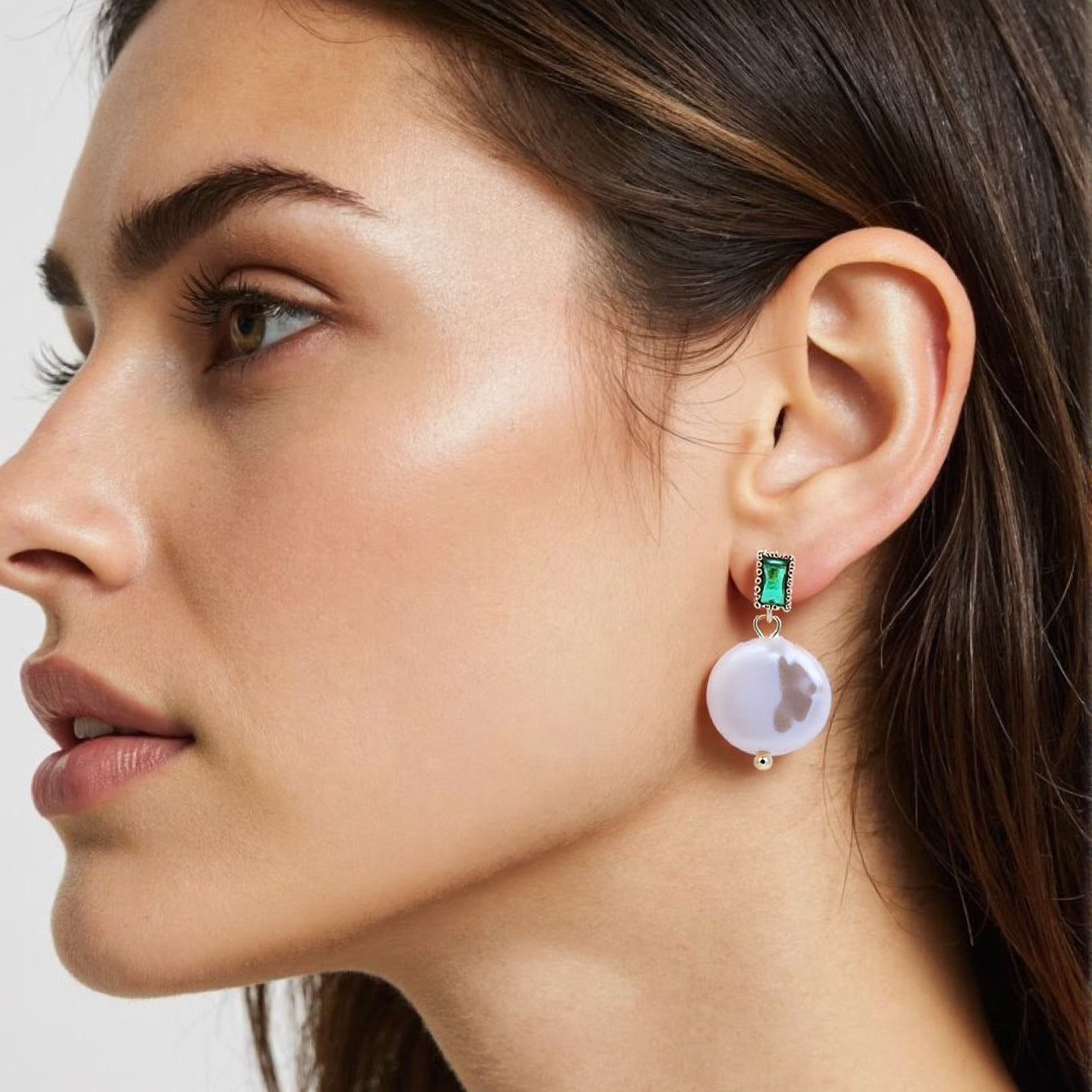 Luxury drop earrings featuring emerald green and baroque pearls