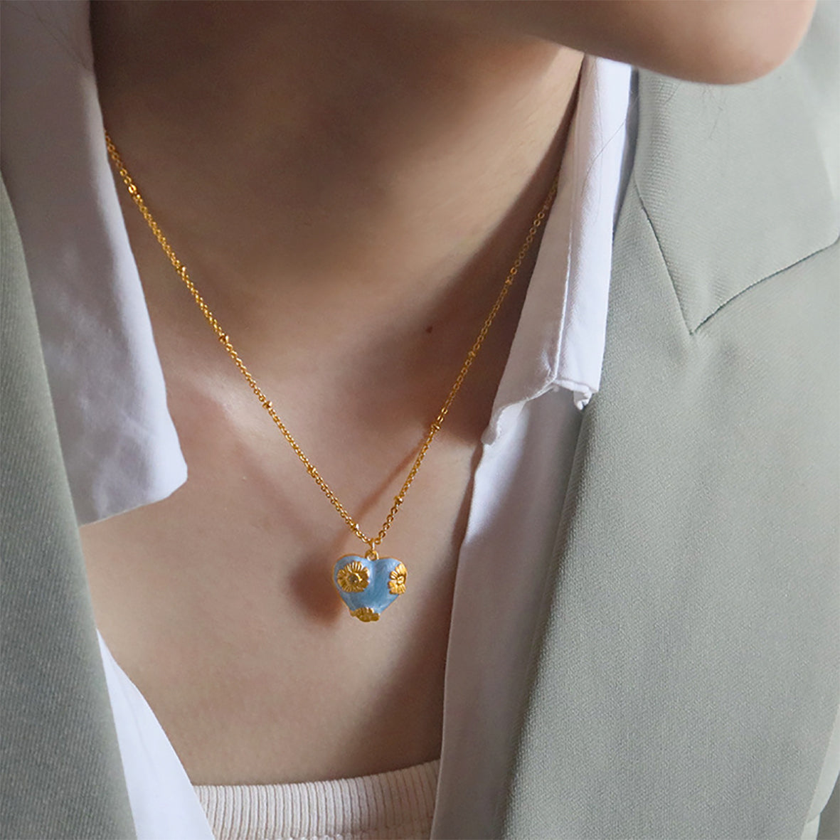 Elegant enamel heart pendant on a delicate chain