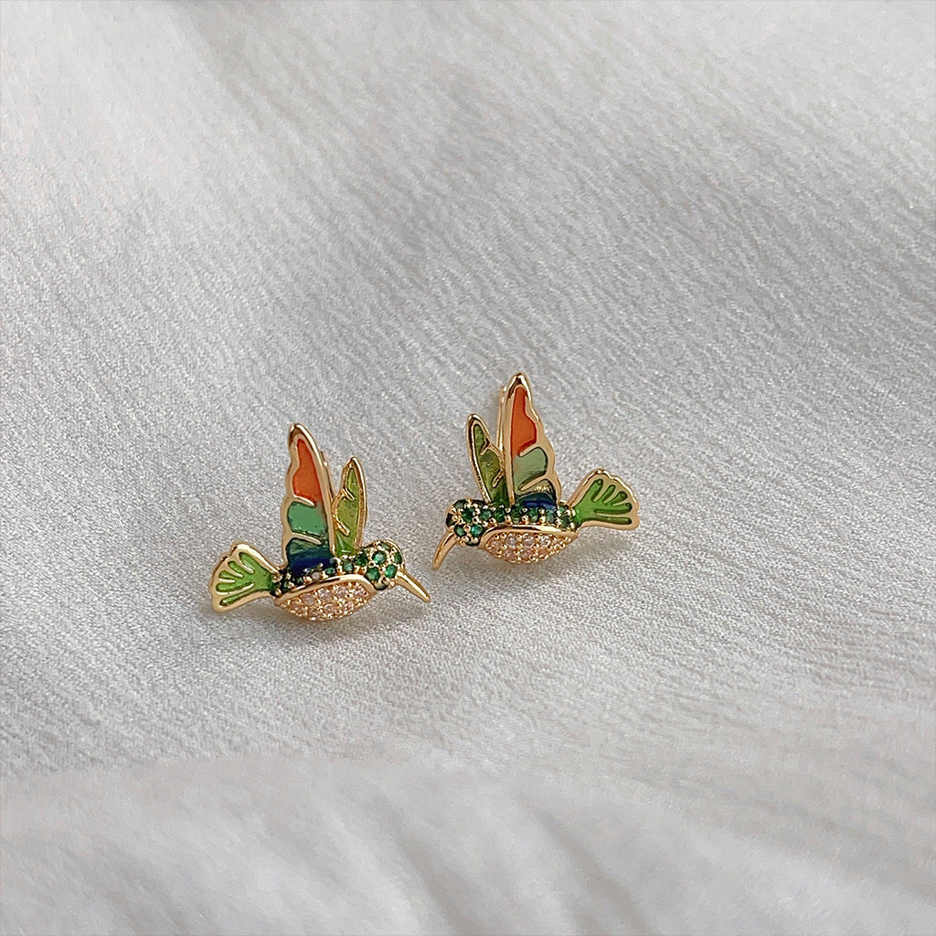 Delicate enamel hummingbird studs, bright and unique