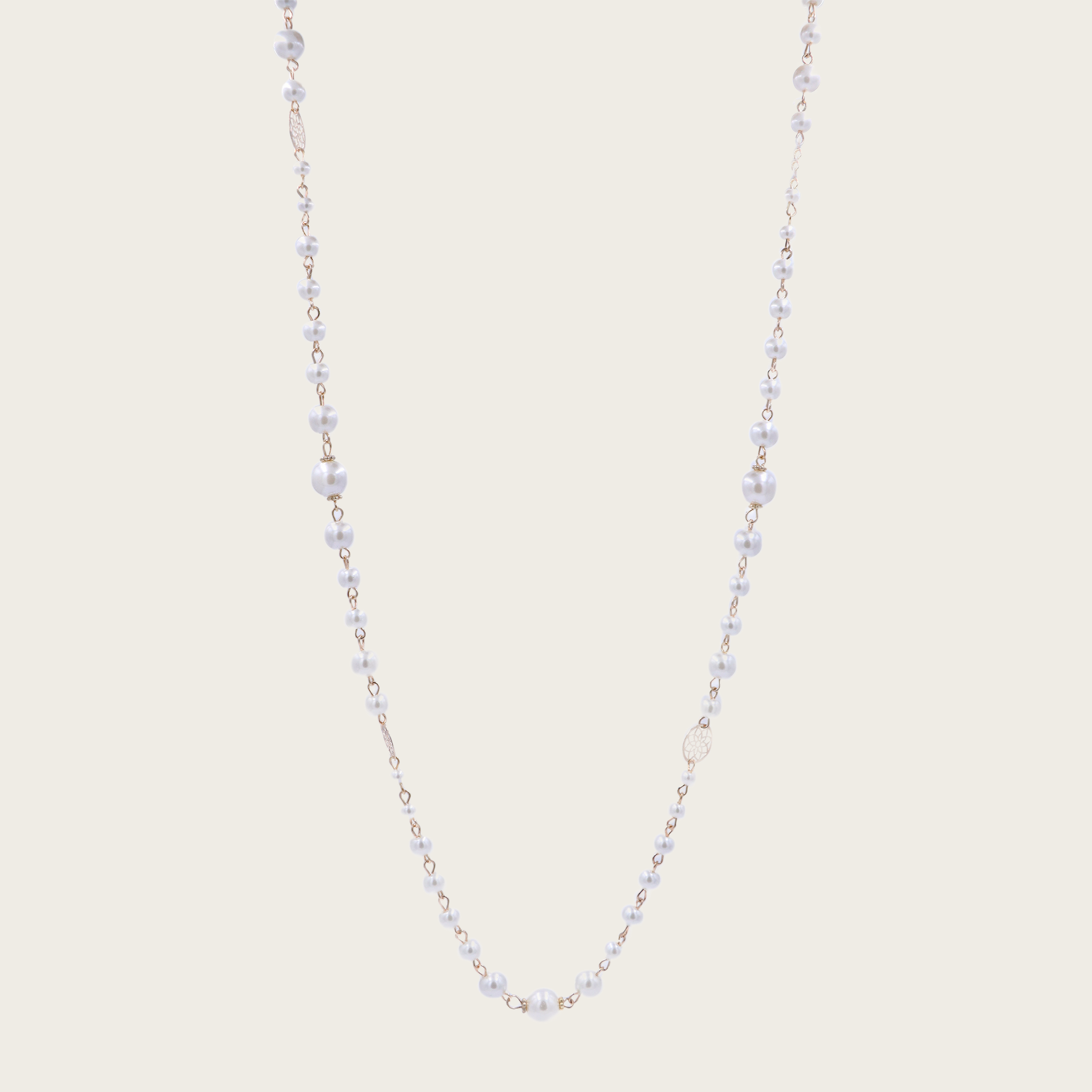 a stunning piece with a floral design and glass pearls