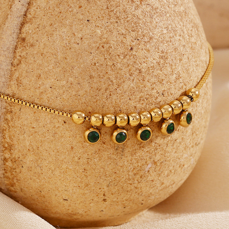 Charming anklet featuring green zircon accents