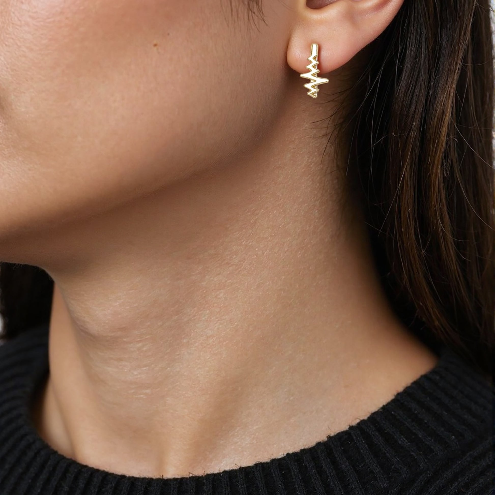 14K gold huggie hoop earrings with a horizontal heartbeat line engraving