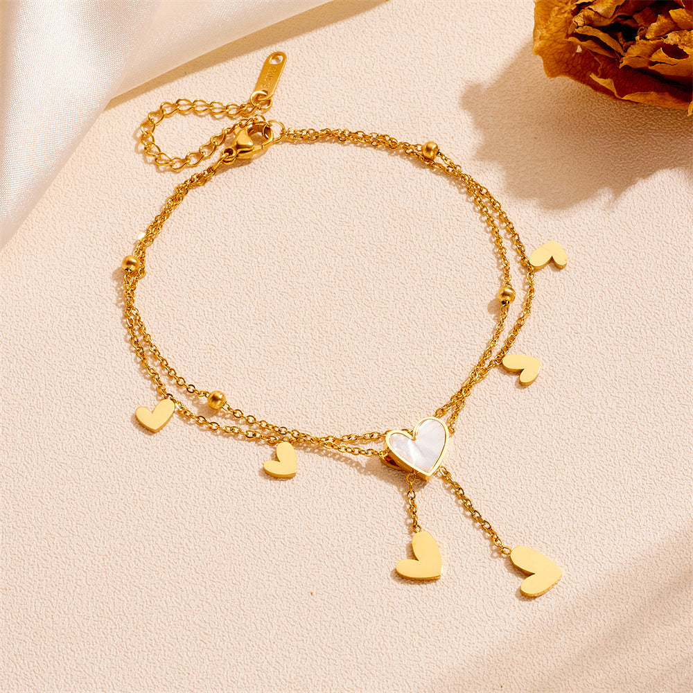 Delicate anklet featuring heart-shaped tassels