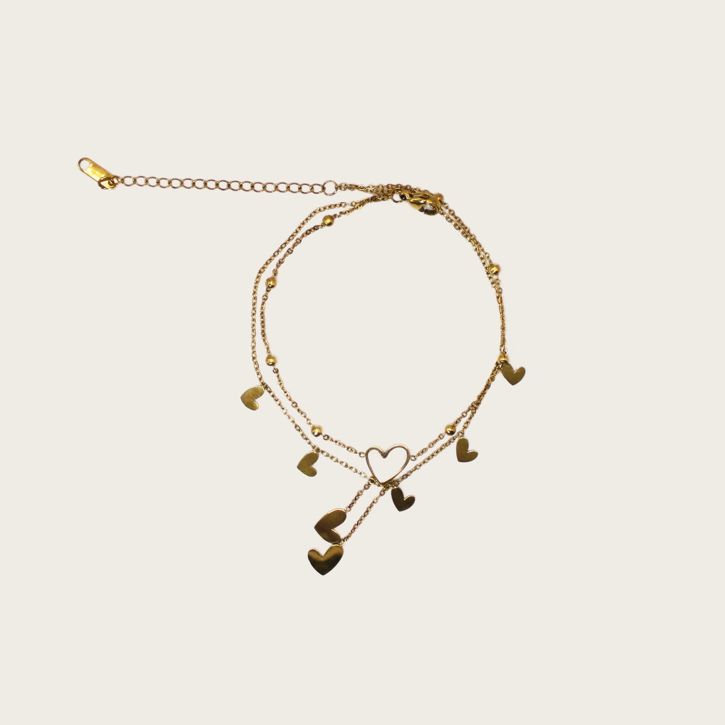Delicate anklet featuring heart-shaped tassels