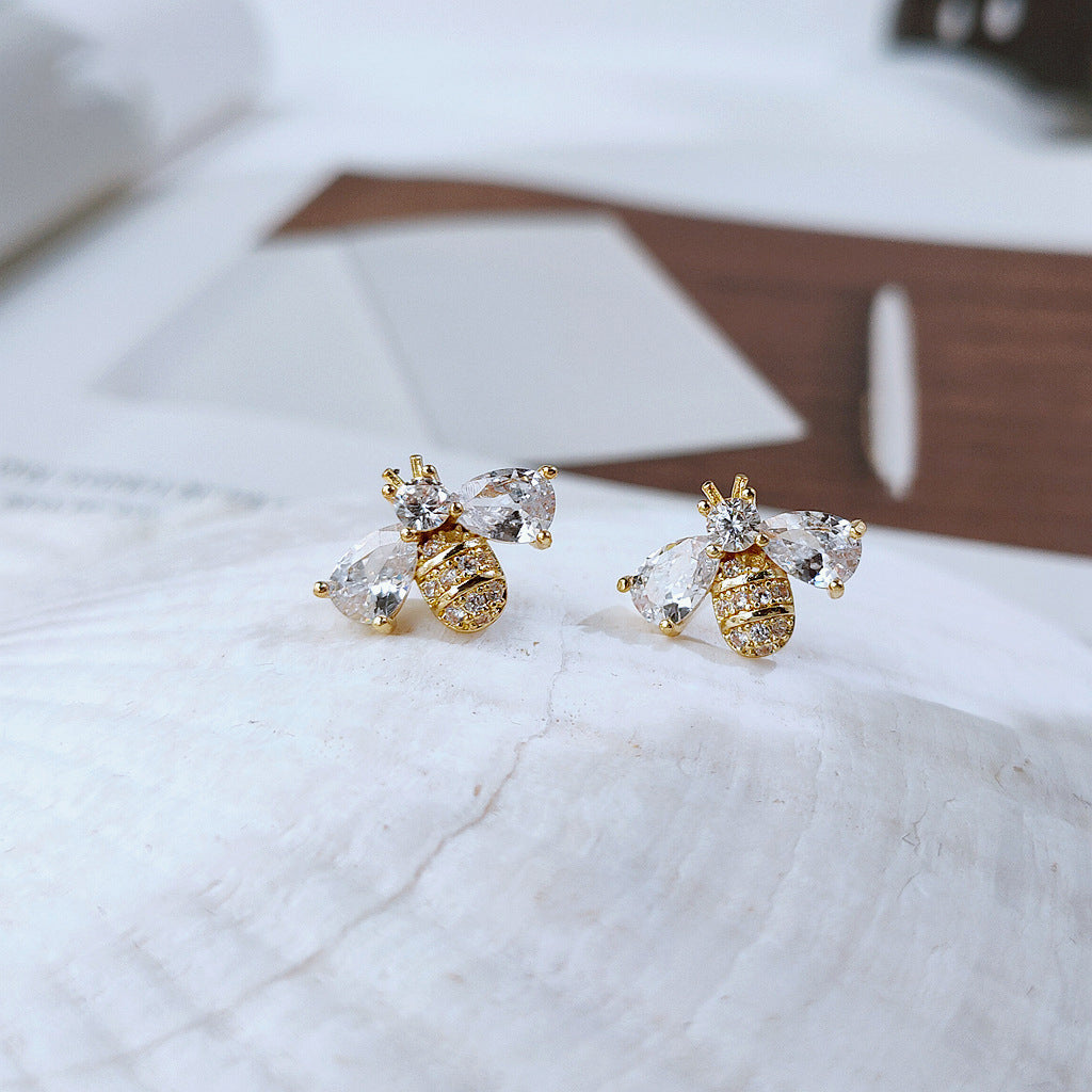 Charming bee earrings featuring zircon accents