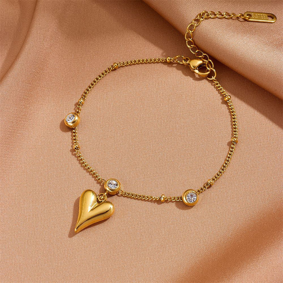 Delicate anklet with small heart pendants on a thin chain