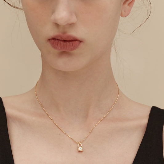 Chic necklace featuring a luxury lock charm