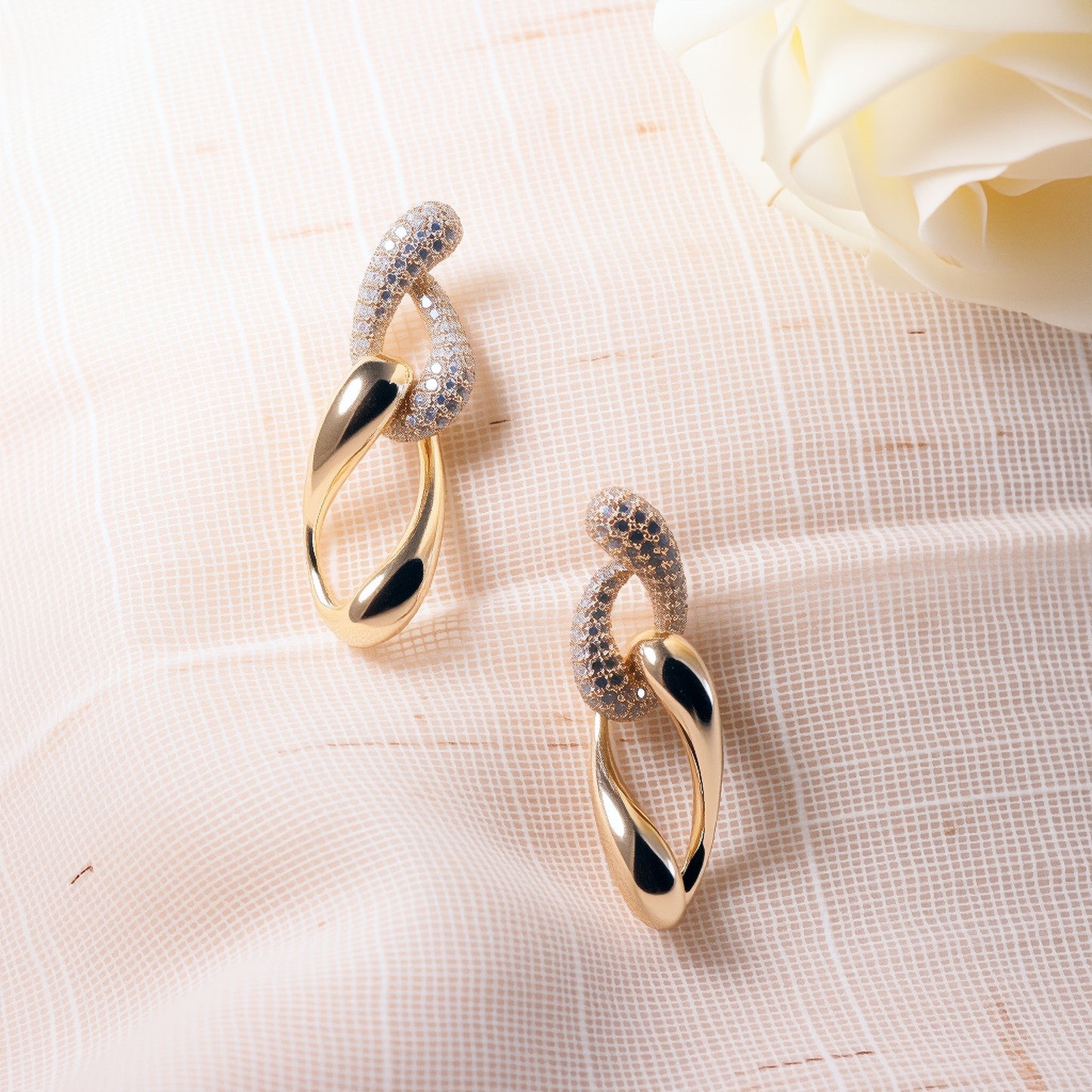 Luxury 18K solid gold twist drop earrings with intricate spiral design and teardrop silhouette