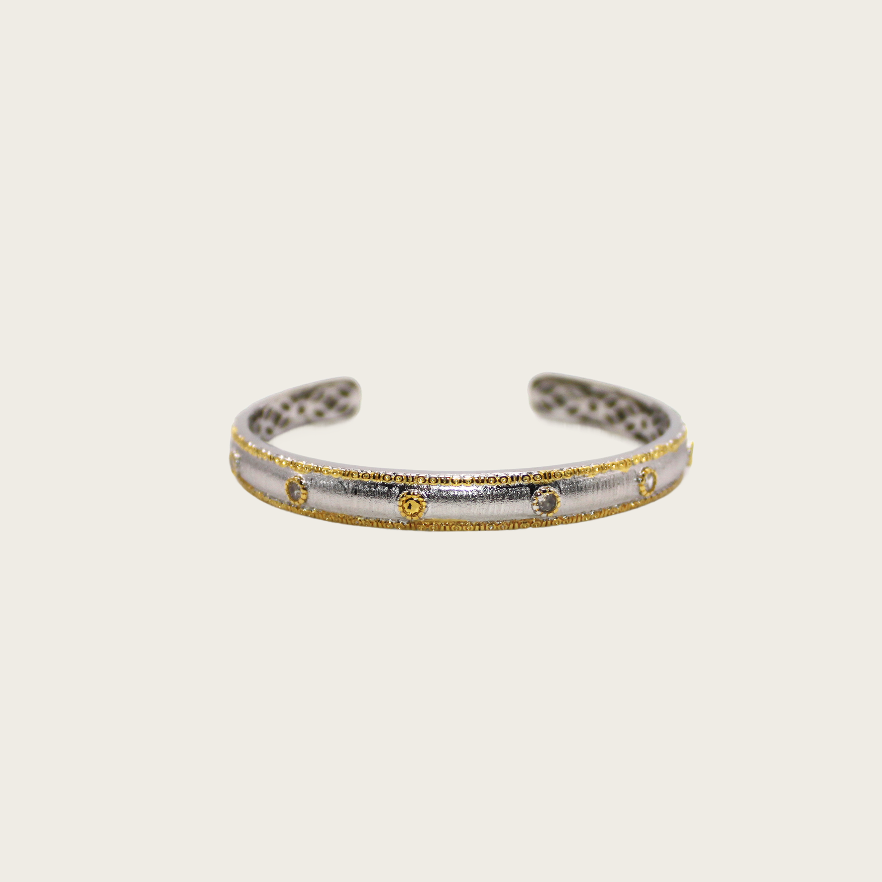 Sleek bangle with vintage-inspired millegrain finish