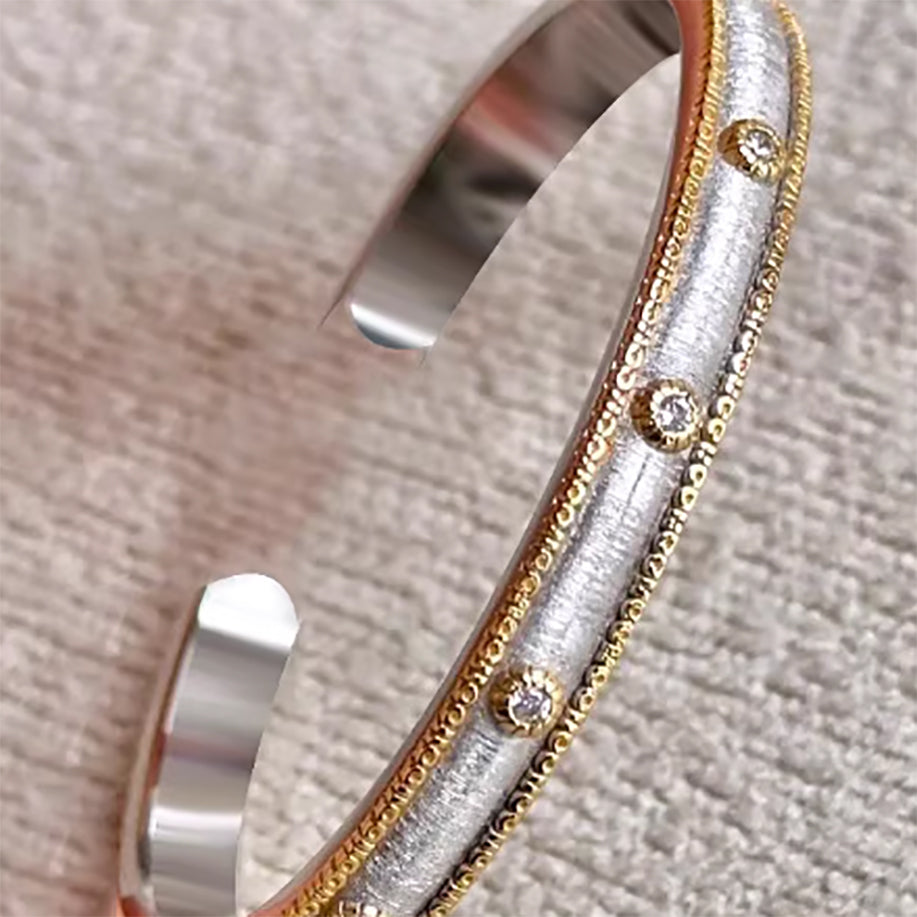 Sleek bangle with vintage-inspired millegrain finish