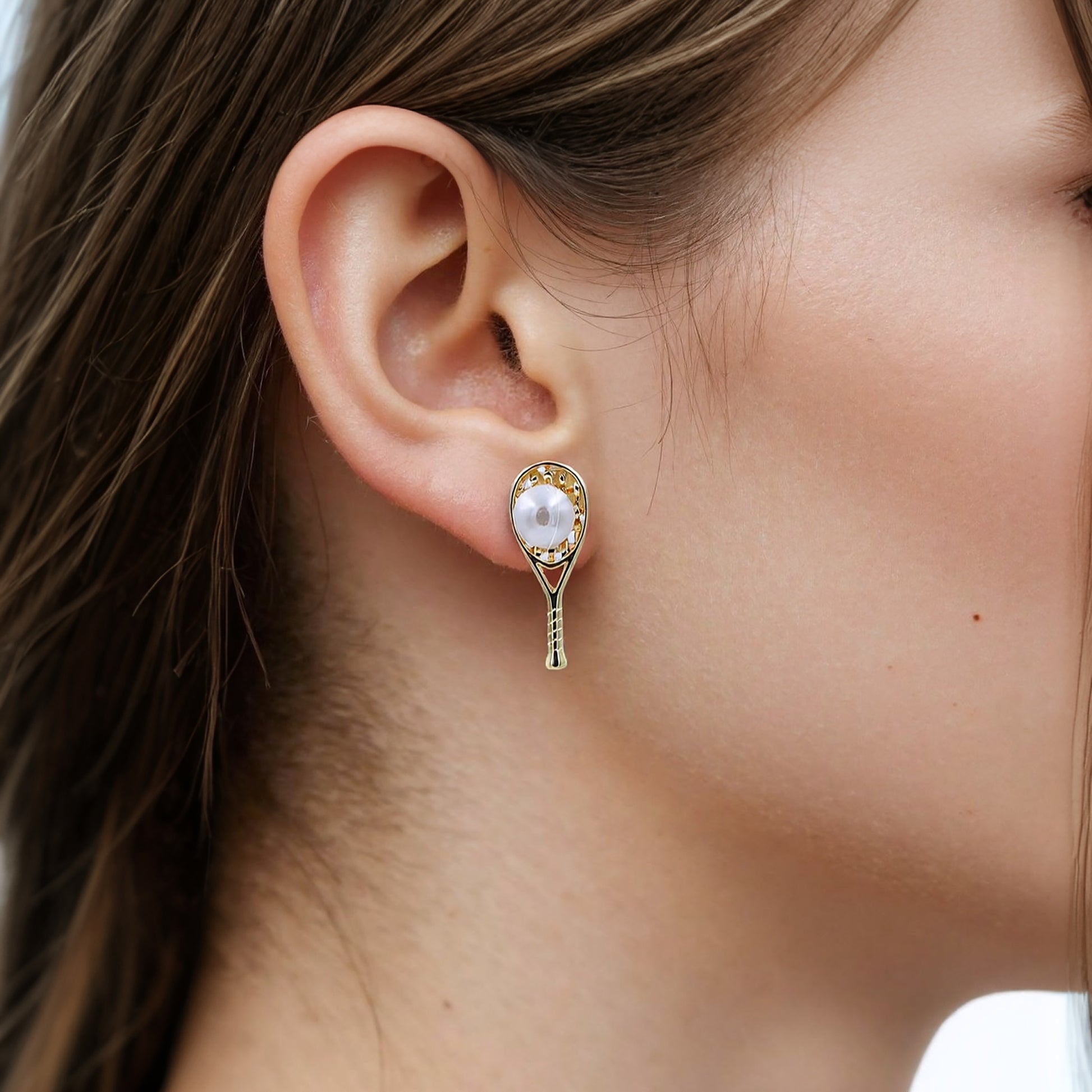 Elegant tennis racket stud earrings with pearl accents