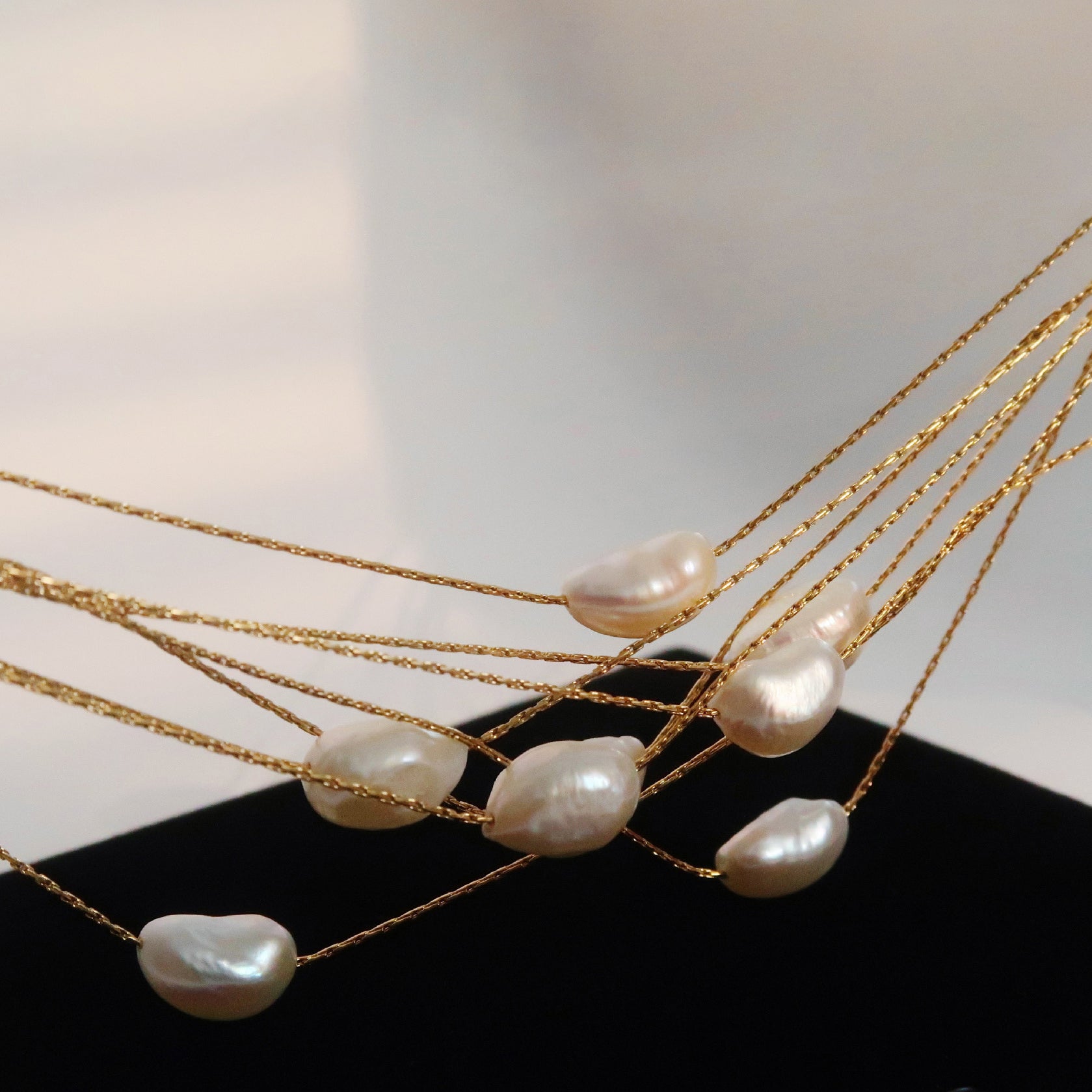 Natural baroque pearl pendant, minimalist style