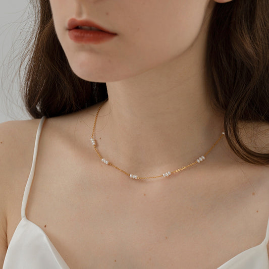 Timeless necklace featuring natural pearl segments
