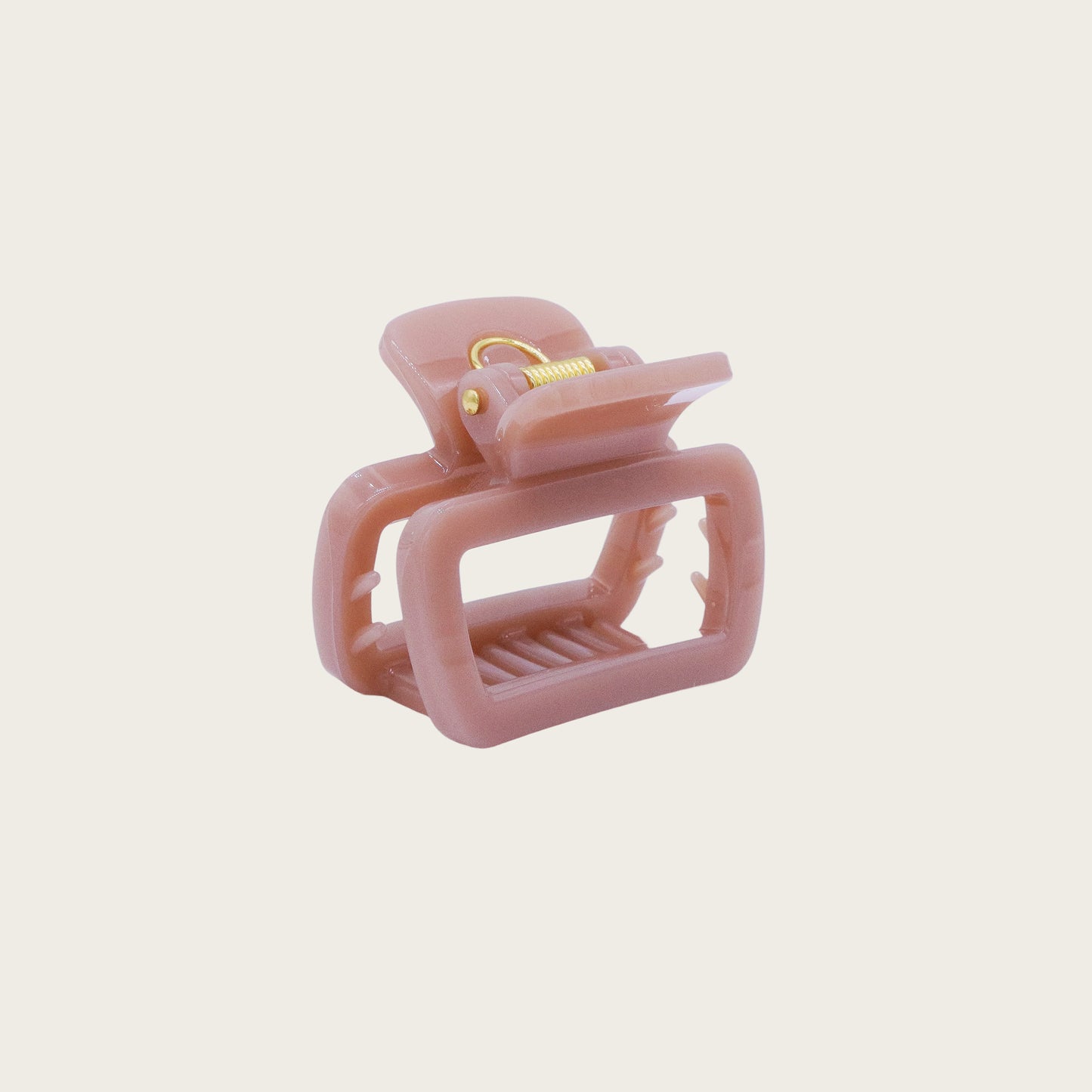 Set of pastel-colored rectangular hair claw clips in pink, mint, and lavender, styled on a wavy half-up hairstyle.