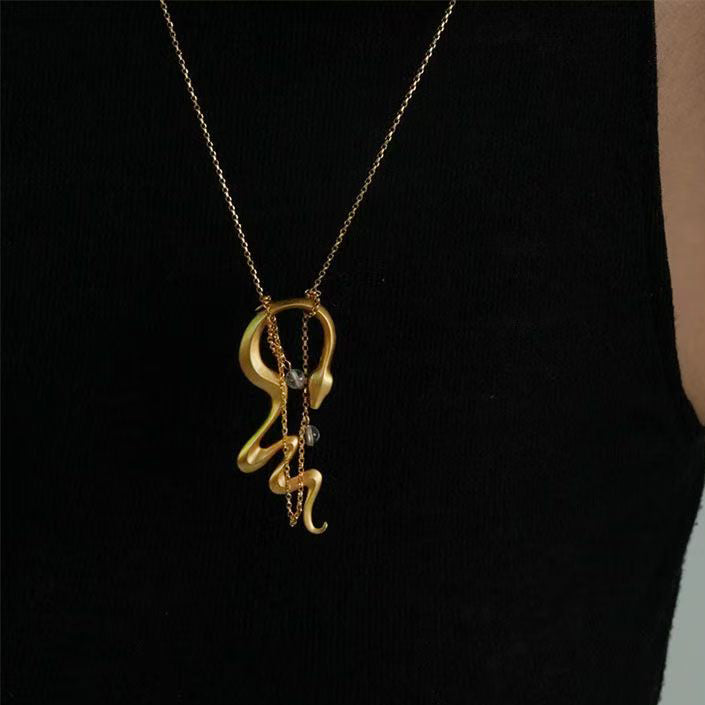 Bold snake-shaped statement necklace with unique design