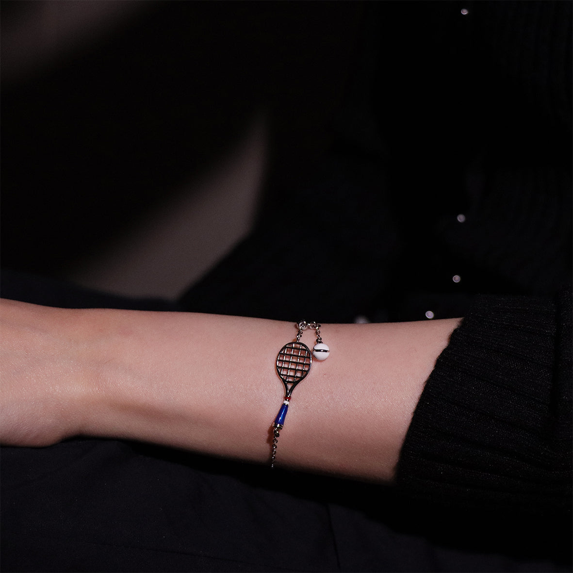 Stylish tennis racket charm bracelet for an athletic touch