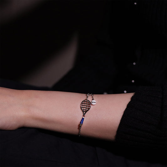 Stylish tennis racket charm bracelet for an athletic touch