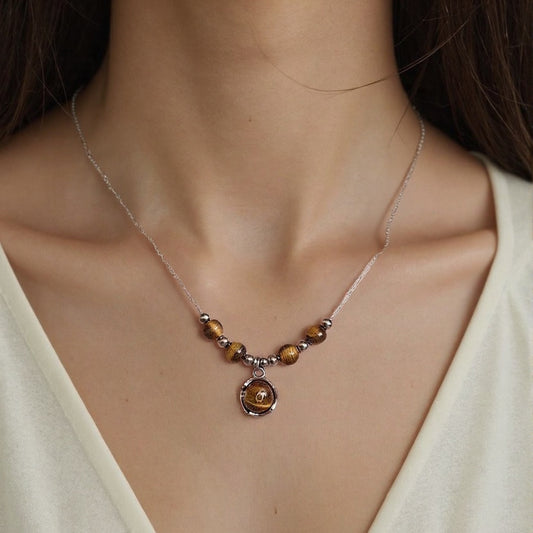 Charming tigerite bead necklace with timeless design.
