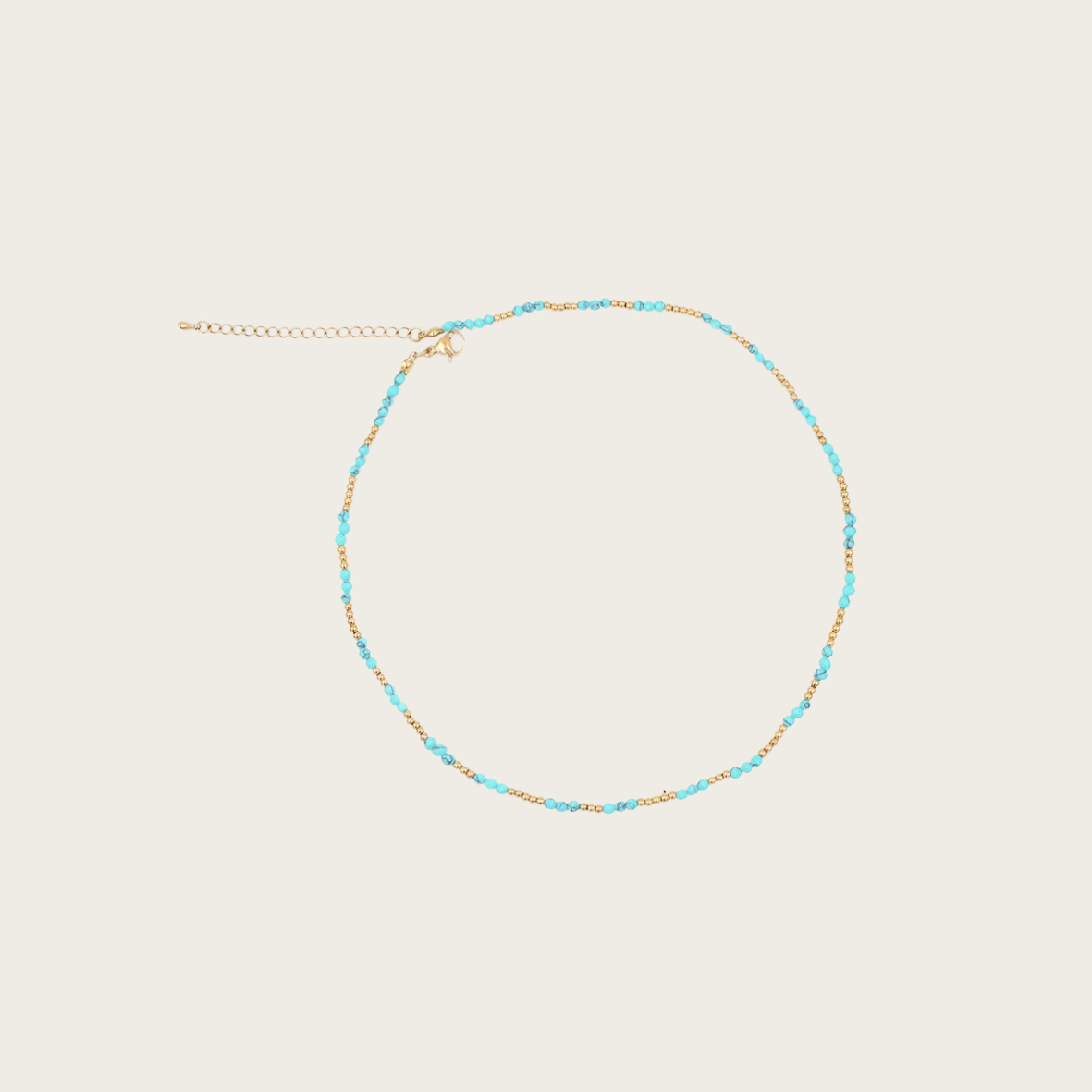 Elegant turquoise bead necklace with French charm.