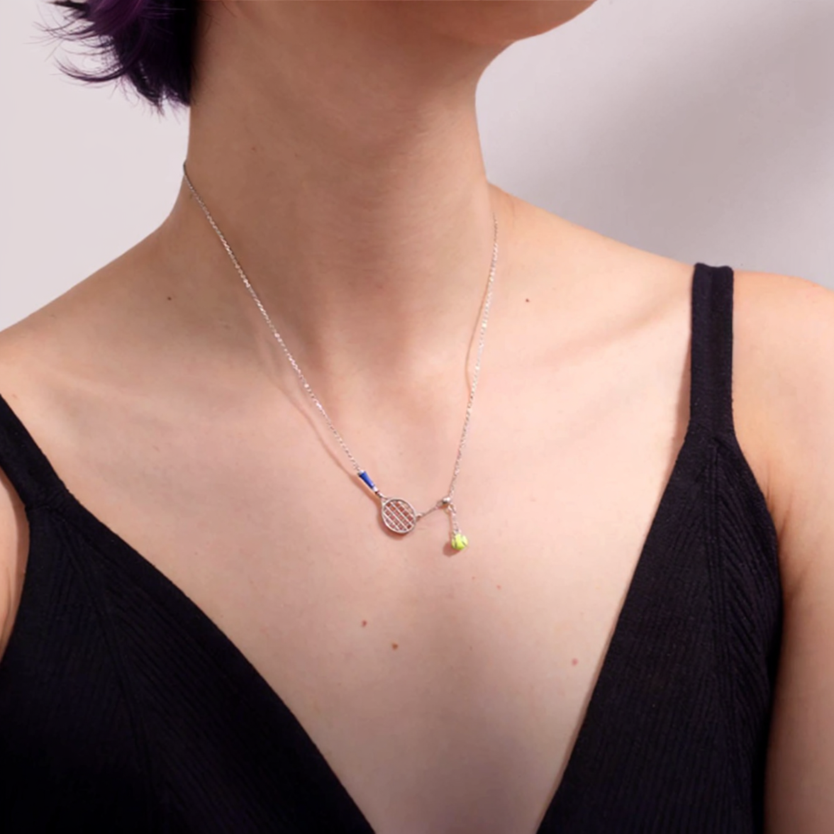 Tennis Racket Pendant Necklace – a unique and fashionable piece of jewelry for anyone who adores the game of tennis.