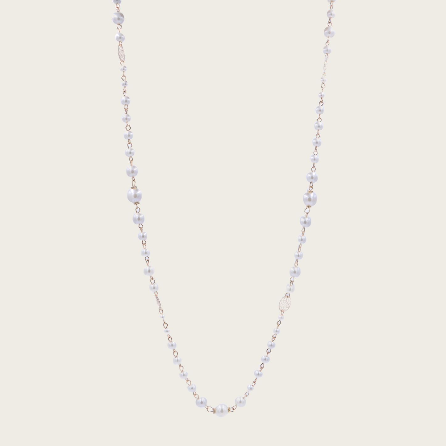 a stunning piece with a floral design and glass pearls