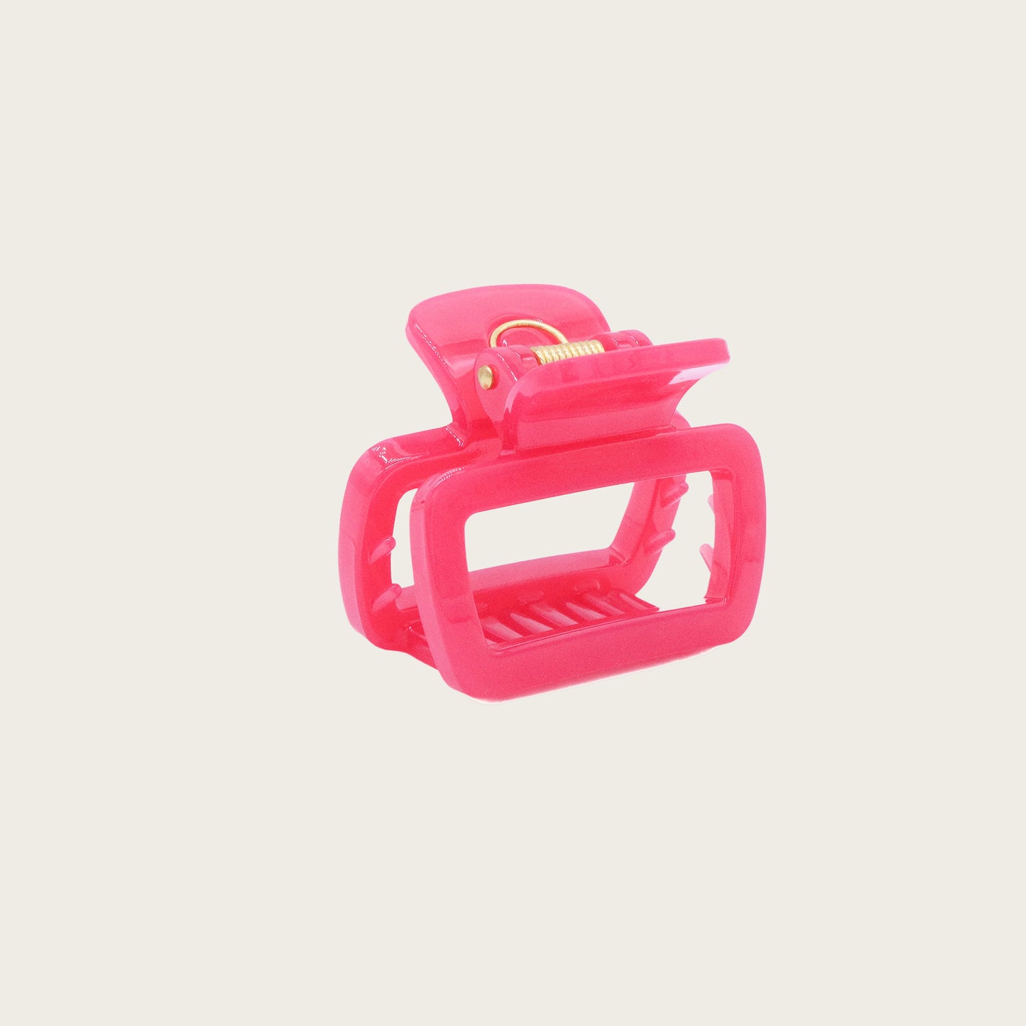 Set of pastel-colored rectangular hair claw clips in pink, mint, and lavender, styled on a wavy half-up hairstyle.