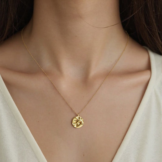 Charming unicorn coin pendant on a sweater necklace